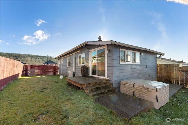 rear view of house with a lawn