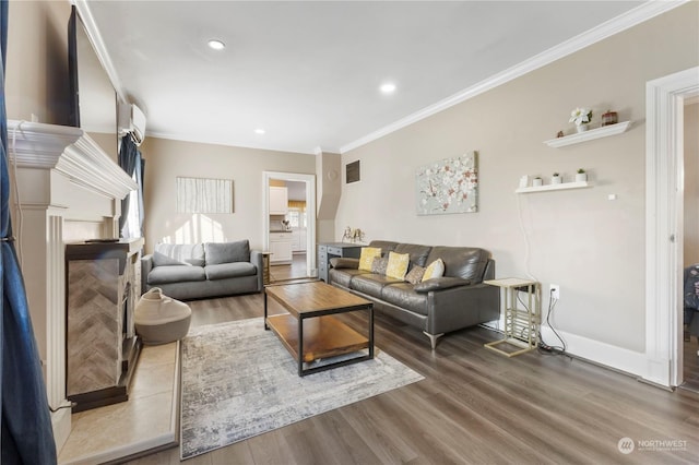 living room featuring hardwood / wood-style floors and ornamental molding