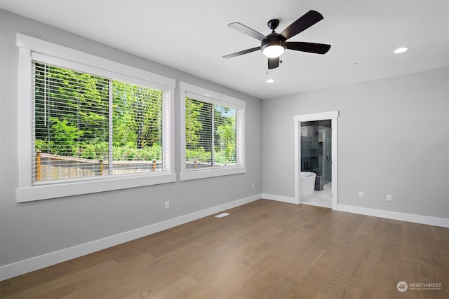 unfurnished room featuring light wood-type flooring and ceiling fan