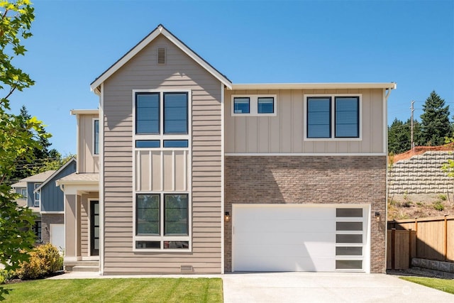 view of front facade featuring a garage and a front lawn