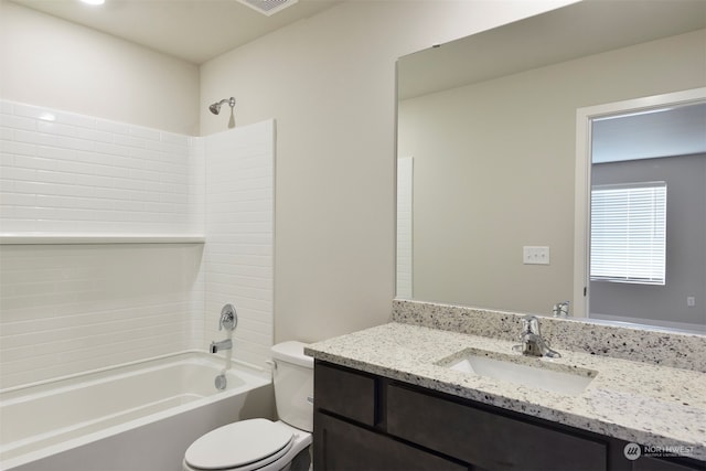 full bathroom featuring washtub / shower combination, vanity, and toilet