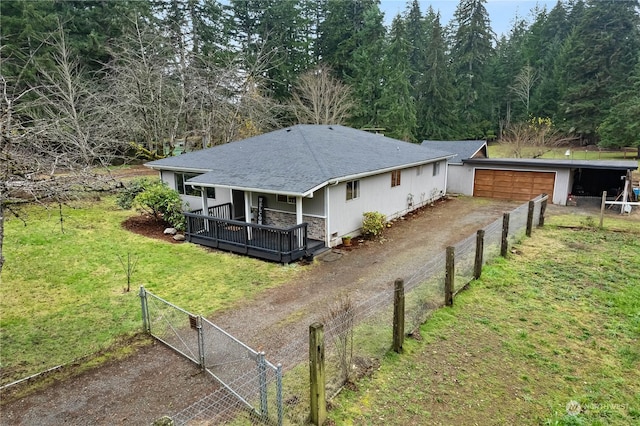 rear view of house featuring a lawn