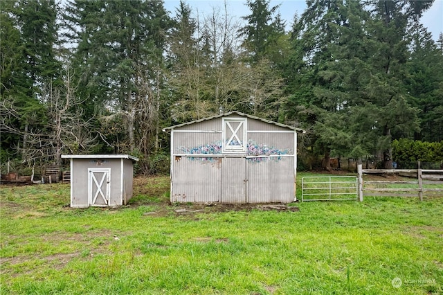 view of outbuilding featuring a yard