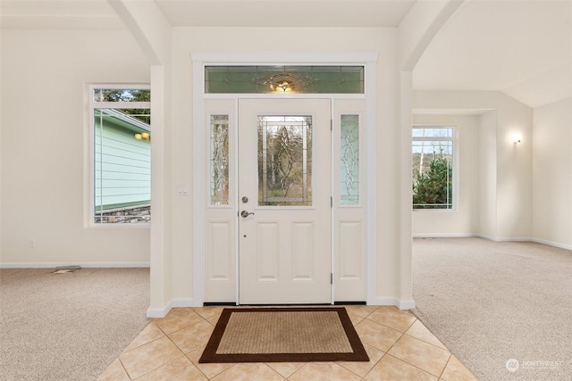 entrance foyer featuring light carpet