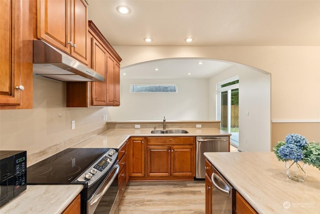 kitchen featuring light hardwood / wood-style floors, sink, and stainless steel appliances