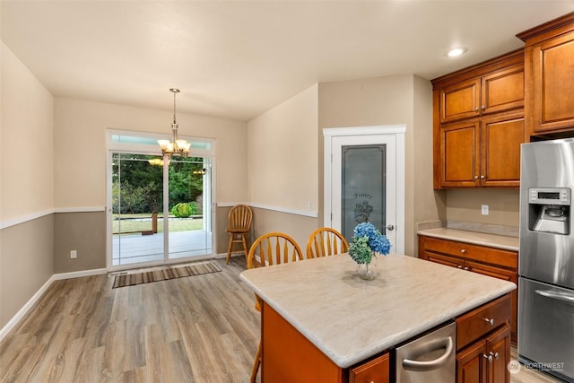 kitchen with pendant lighting, a center island, stainless steel refrigerator with ice dispenser, light wood-type flooring, and a notable chandelier