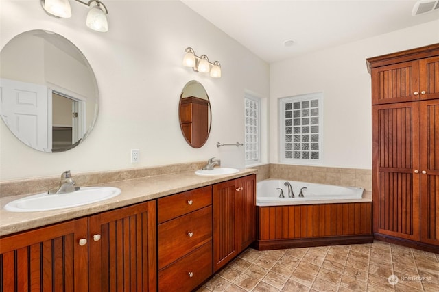 bathroom featuring a bathing tub and vanity