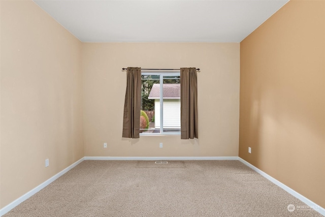 empty room with carpet flooring