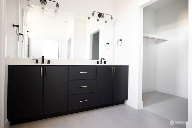 bathroom featuring tile patterned floors and vanity