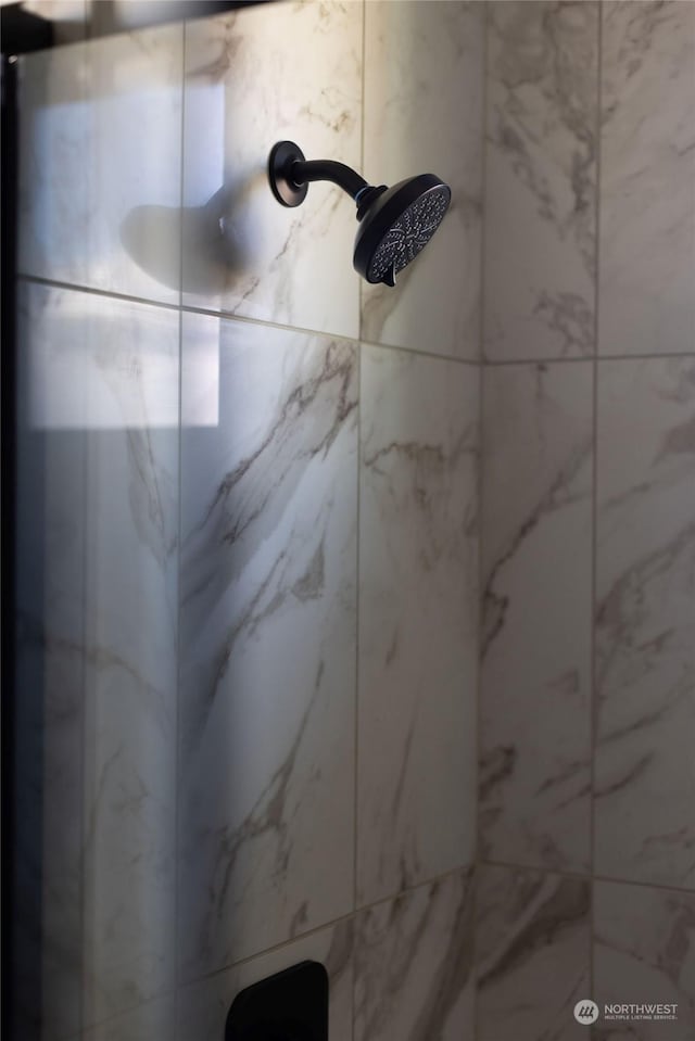 details featuring a tile shower