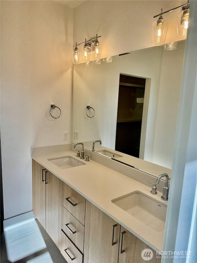 bathroom with double vanity and a sink