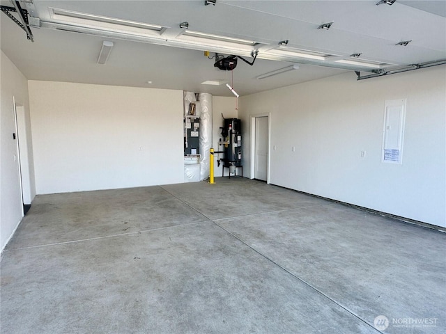 garage featuring a garage door opener, electric panel, hybrid water heater, and heating unit