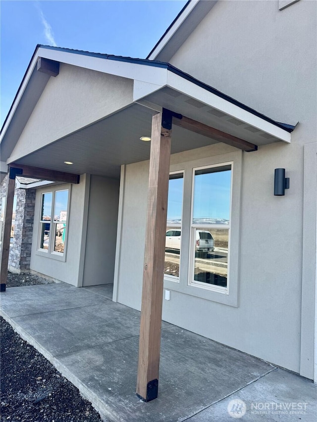 view of home's exterior with a patio area and stucco siding