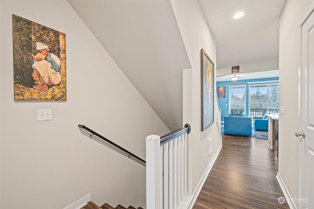 hallway with dark hardwood / wood-style floors