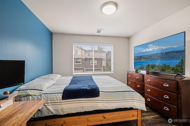 bedroom featuring dark hardwood / wood-style flooring