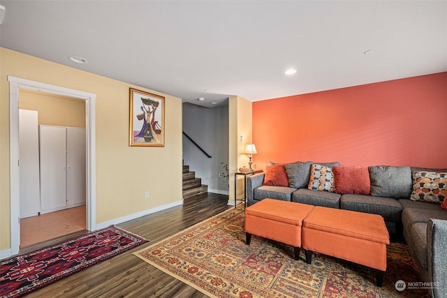 living room with dark hardwood / wood-style flooring