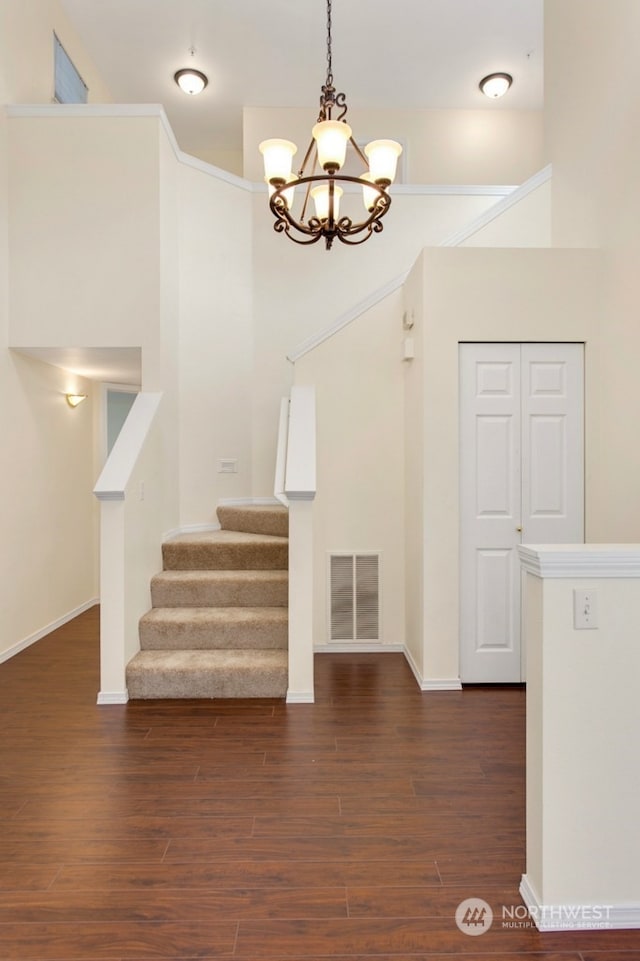 interior space with a chandelier and hardwood / wood-style floors