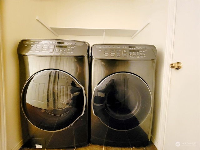 laundry area with independent washer and dryer