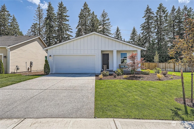 view of front of home featuring a front yard and a garage