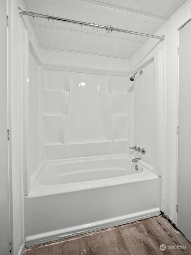 bathroom with shower / bath combination and wood-type flooring