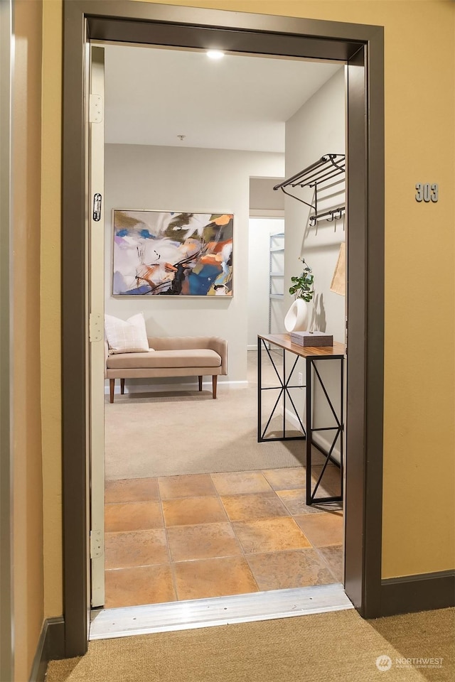 corridor featuring carpet flooring