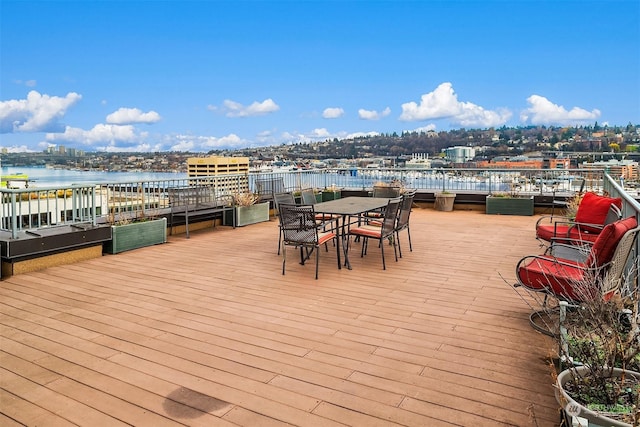 wooden deck featuring a water view