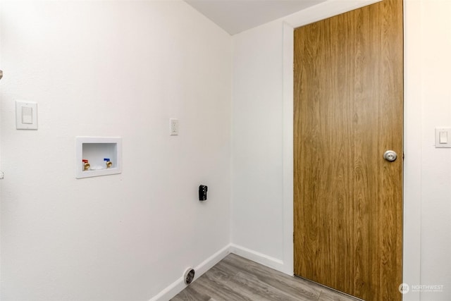 clothes washing area with washer hookup, electric dryer hookup, and light hardwood / wood-style flooring