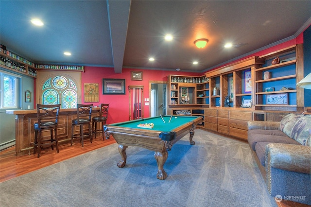 playroom with beamed ceiling, wood-type flooring, ornamental molding, and pool table