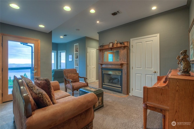 living room featuring a water view, ornamental molding, and light carpet