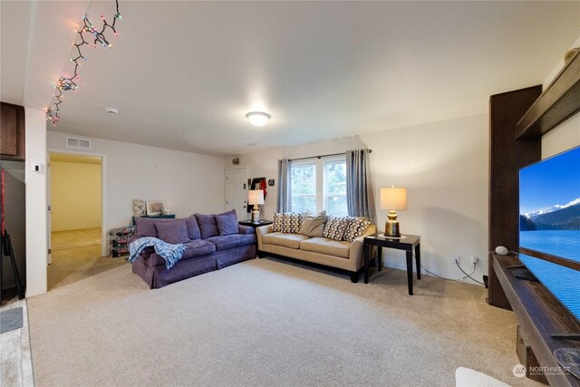 living room featuring light carpet