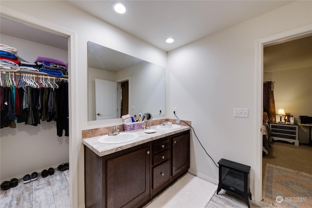 bathroom featuring vanity and hardwood / wood-style flooring