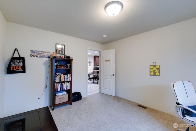 office area with light colored carpet