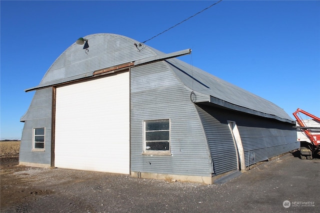 view of side of property featuring an outdoor structure