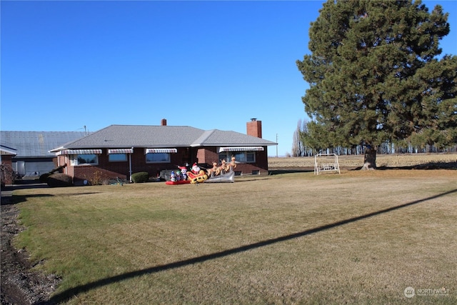 back of property featuring a lawn