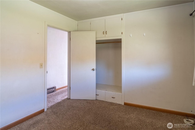 unfurnished bedroom with a closet, carpet flooring, baseboards, and visible vents