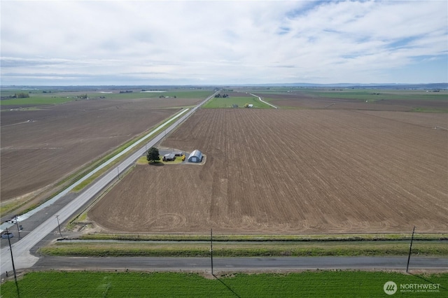 birds eye view of property featuring a rural view