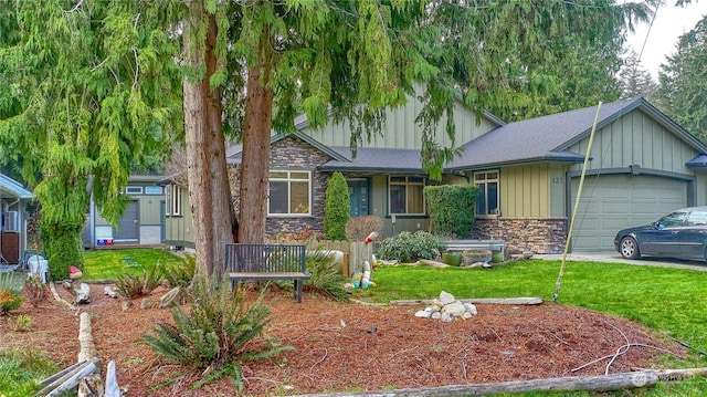 view of front of house with a garage and a front yard