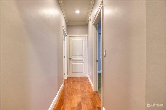 corridor featuring light hardwood / wood-style floors and ornamental molding