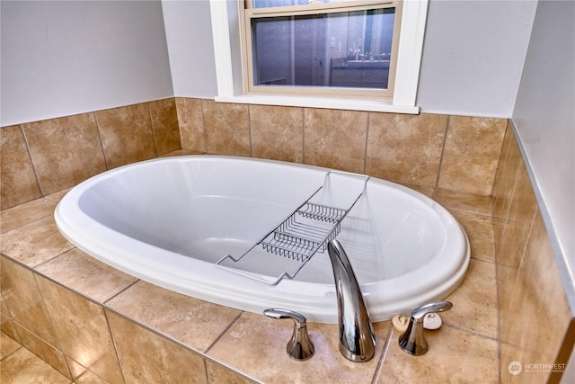 bathroom featuring tiled bath