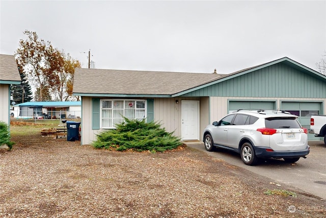 ranch-style home with a garage