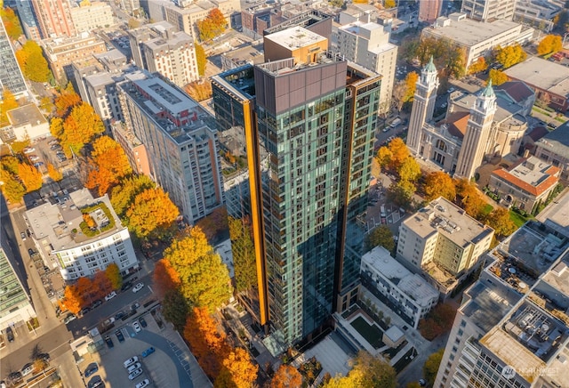 birds eye view of property with a view of city