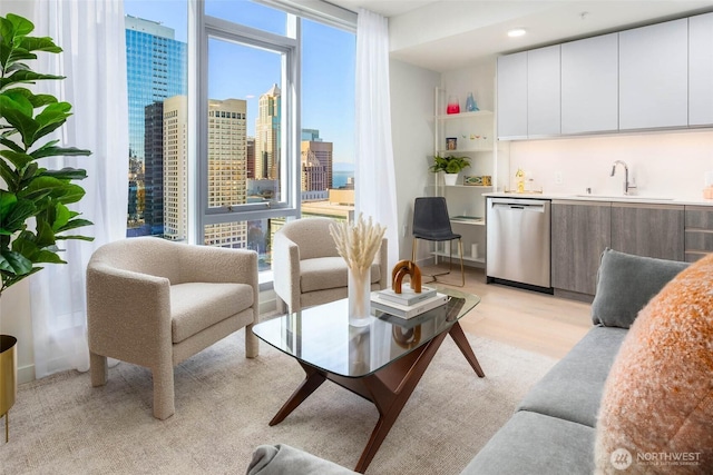 living room with light wood-style floors and a view of city