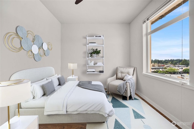 bedroom featuring hardwood / wood-style floors and ceiling fan