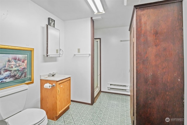 bathroom with vanity, a baseboard heating unit, tile patterned flooring, toilet, and a shower with shower door