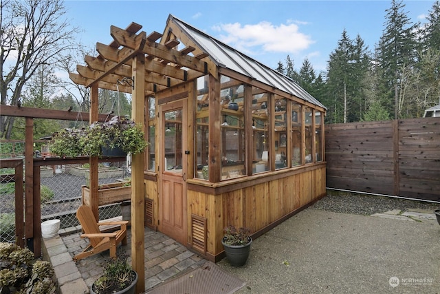 view of patio featuring an outbuilding