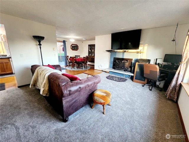 living room featuring a textured ceiling and hardwood / wood-style flooring