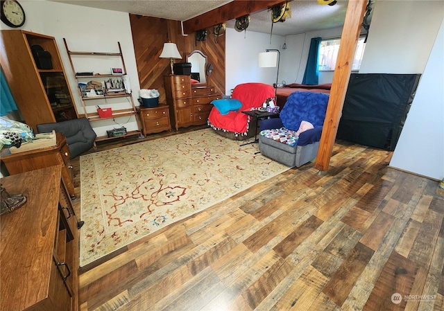 interior space featuring a textured ceiling and dark wood-type flooring