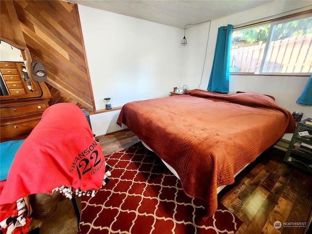 bedroom featuring dark hardwood / wood-style flooring