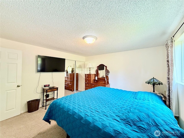 117 Heritage Dr, Elma, WA 98541 - bedroom featuring a closet, carpet, and a textured ceiling