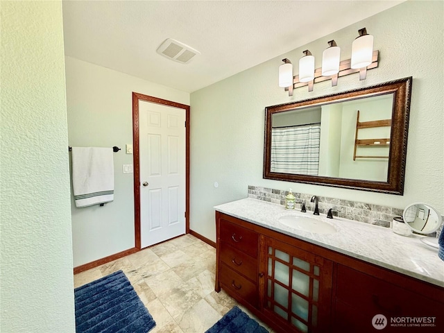 117 Heritage Dr, Elma, WA 98541 - bathroom with vanity, baseboards, and visible vents